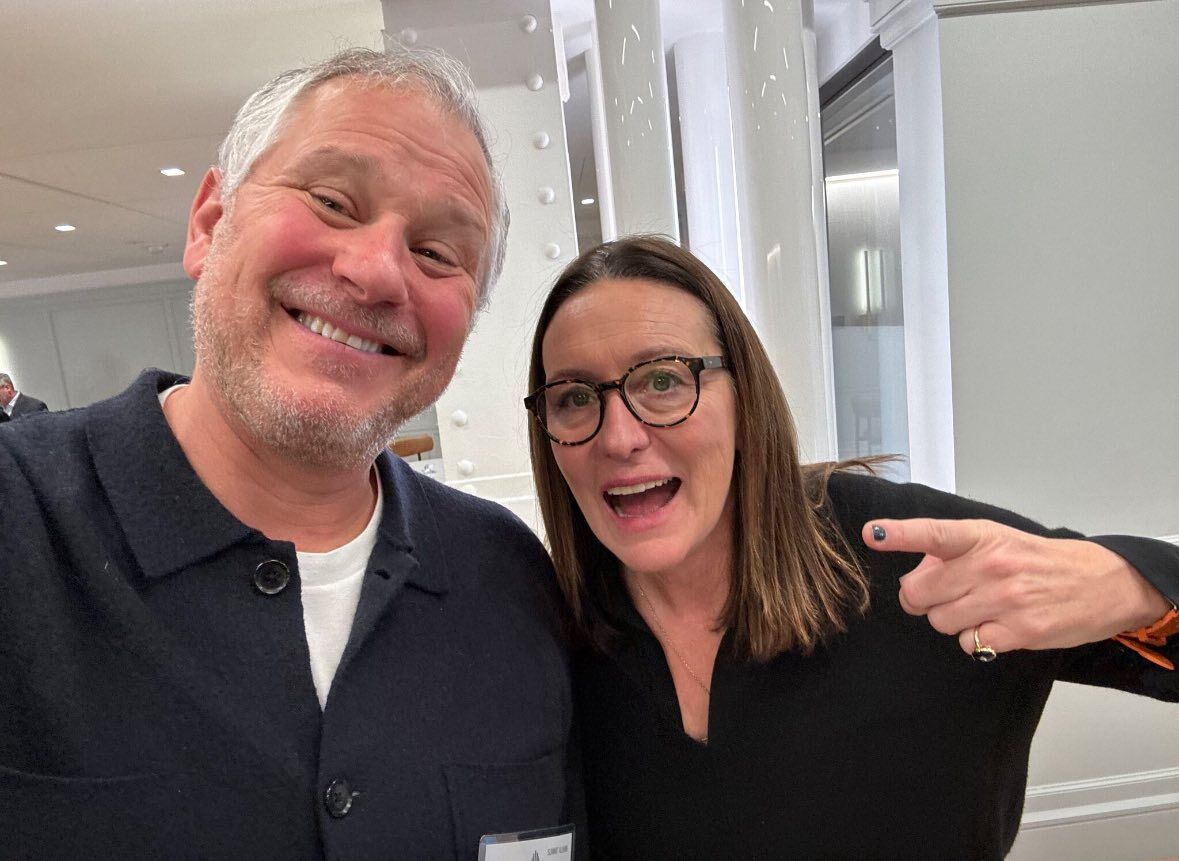Guests sharing a light moment at an AI Trailblazers summit